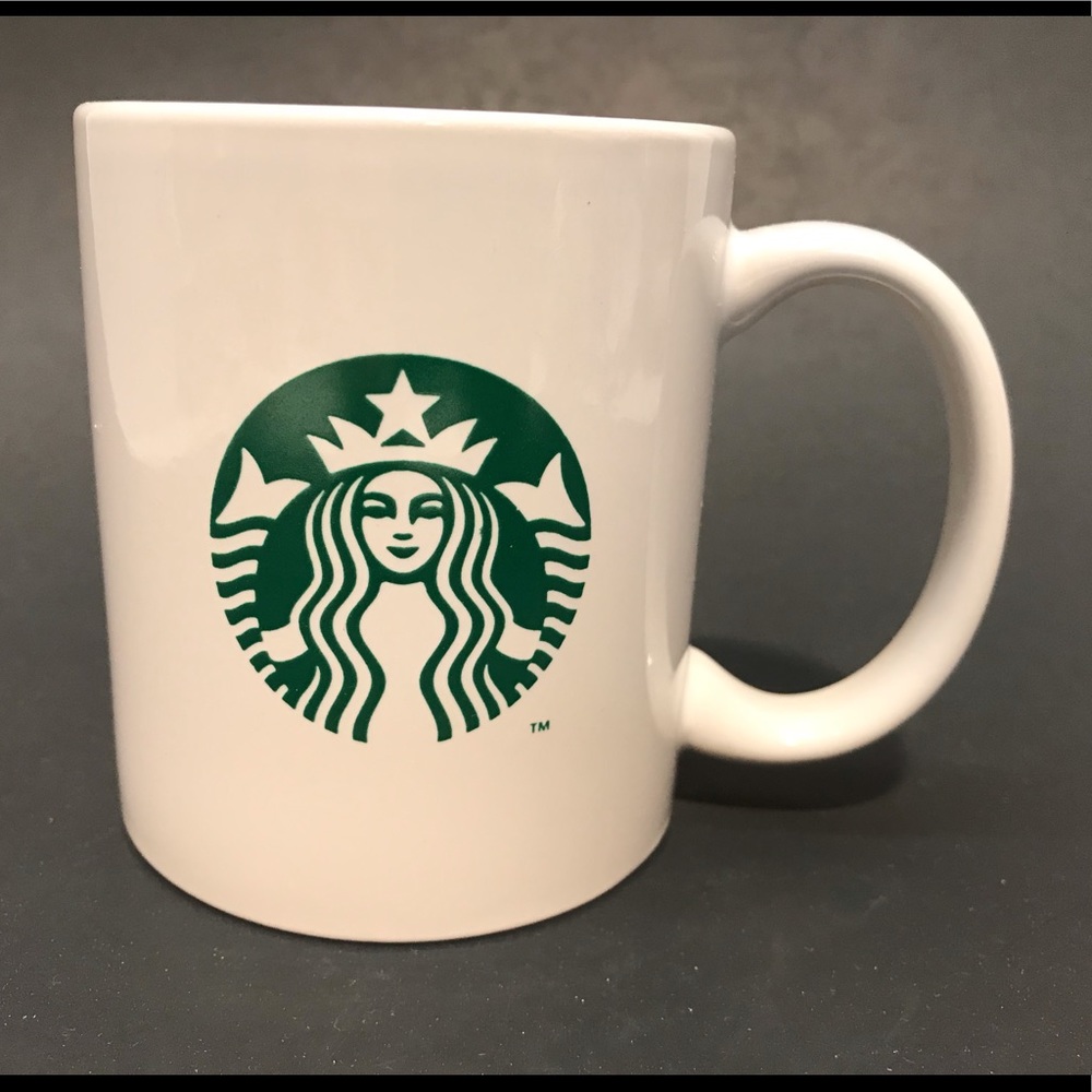 Starbucks coffee cup with green mermaid logo.
